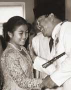 Sukarno with his daughter and future president, Megawati Sukarnoputri, at a state reception in January, 1960